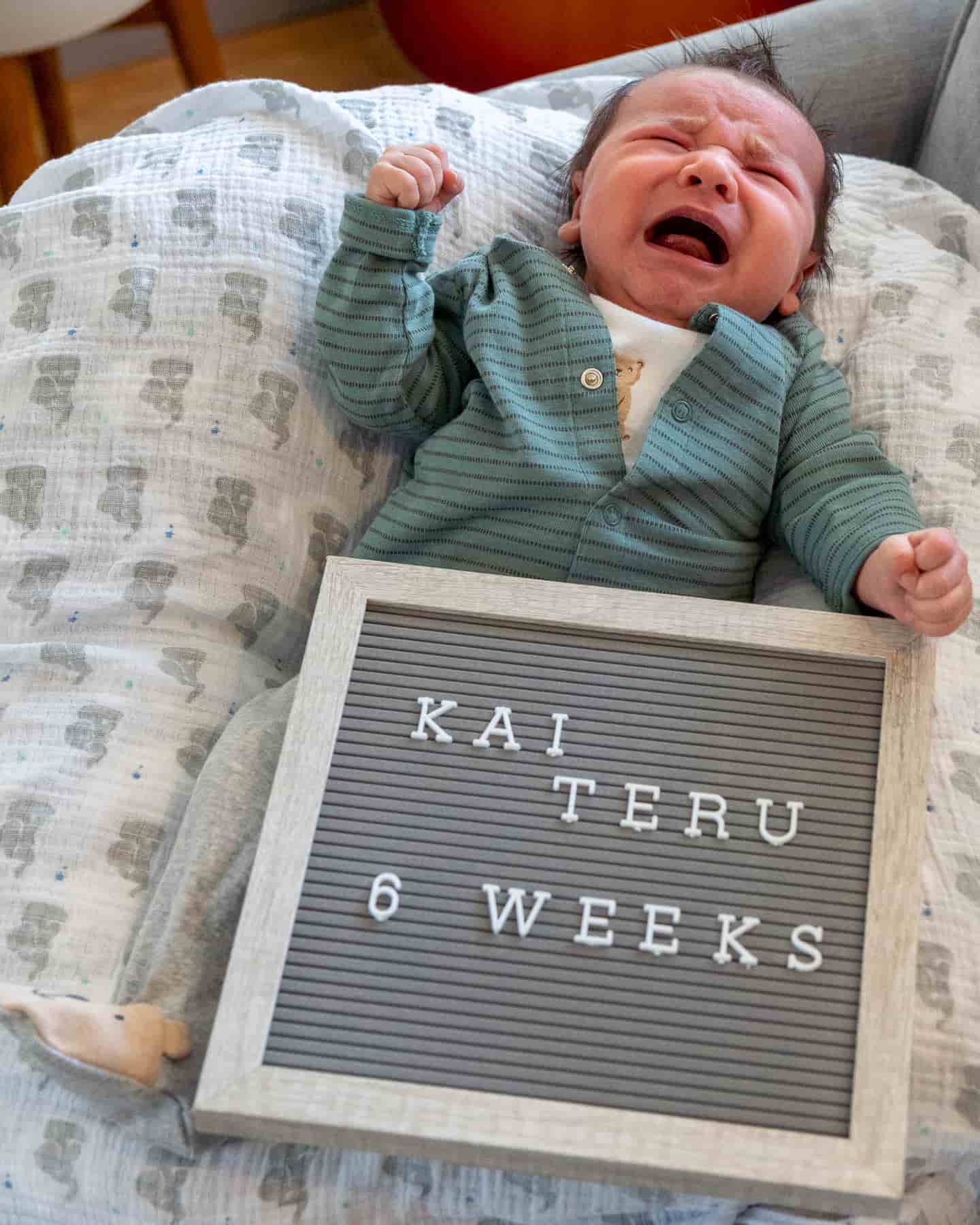 cute baby with framed felt letter board